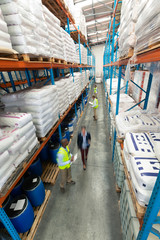 Fototapeta na wymiar Warehouse staff checking stocks in warehouse