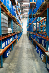 Fototapeta premium Barrel and crates on a rack in warehouse