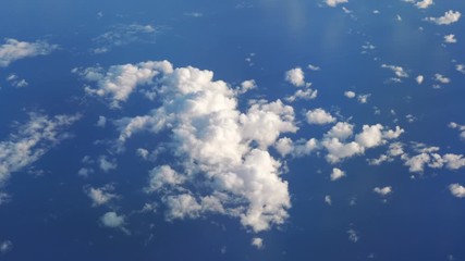 Aerial shot above the clouds in 4K slow motion 60fps