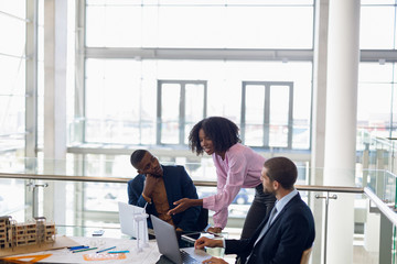 Diverse young business people working together in a modern office