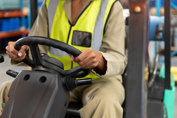 Female staff driving forklift in warehouse © WavebreakMediaMicro