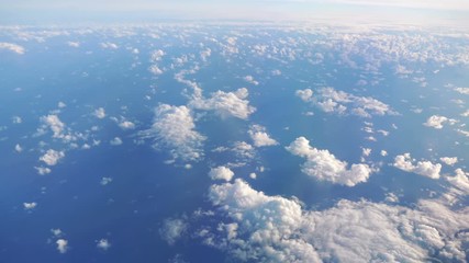 Aerial shot above the clouds in 4K slow motion 60fps