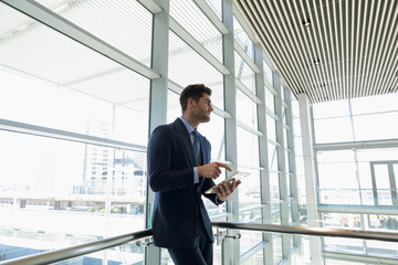 Businessman using tablet computer at work