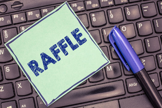 Writing note showing Raffle. Business photo showcasing means of raising money by selling numbered tickets offer as prize.