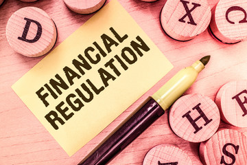 Handwriting text writing Financial Regulation. Concept meaning aim to Maintain the integrity of Finance System.