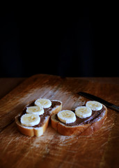 White bread with chocolate paste and bananas