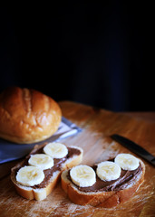 White bread with chocolate paste and bananas