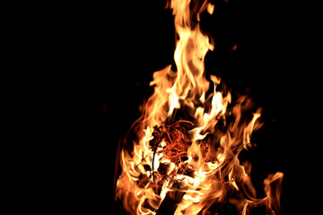 Fire bonfire on a black background,  natural flame