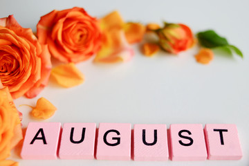 August text pink tile, with roses, on a white background.