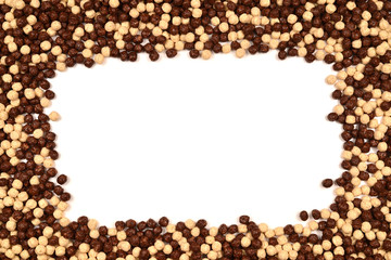 Frame of chocolate corn flakes  isolated on white background.