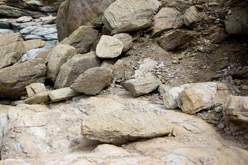 Background texture of rough cliff rock wall