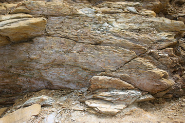 Background texture of rough cliff rock wall