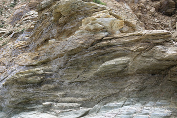 Background texture of rough cliff rock wall