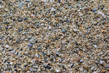 Small pebbles on a beach background