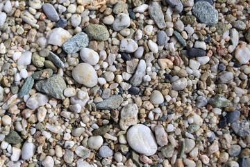 Small pebbles on a beach background