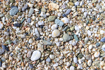 Small pebbles on a beach background