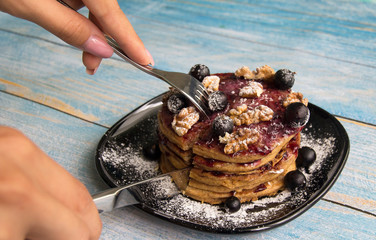 Pancake with currant jam and currant berries