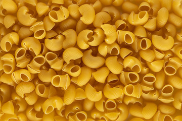 Group of Pipe rigatte shape of italian pasta as background banner