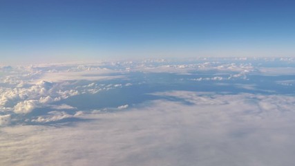 Aerial shot above the clouds in 4K slow motion 60fps