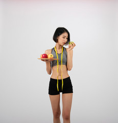 sporty fitness woman in sportswear with apple.  healthy sport lifestyle