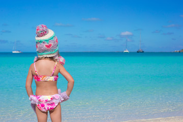Little cute adorable girl on tropical beach
