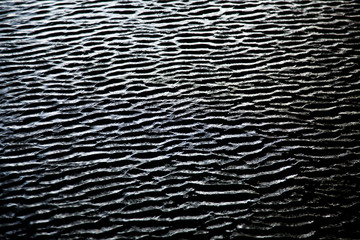 dark ripples on water