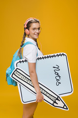 Portrait of schoolgirl with big notepad template