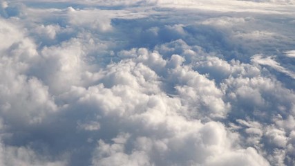Aerial shot above the clouds in 4K slow motion 60fps