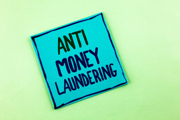 Conceptual hand writing showing Anti Monay Laundring. Business photo showcasing entering projects to get away dirty money and clean it written Sticky Note Paper the plain background.