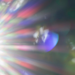 Dreamy and abstract image of the sunrays. Natural rays of the visible light in the colors red,...