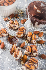 Obraz na płótnie Canvas Healthy dietary snack. Vegan food, Chocolate energy protein bars with coconut and almond