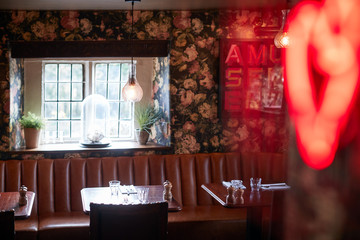 Interior Of Traditional English Pub With Table Set For Meal