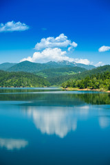 Croatia, beautiful lake in Gorski kotar, Lokve, Risnjak mountain in background, reflection in watter
