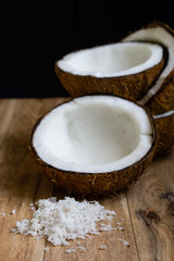 Raw fresh coconut on wooden background.