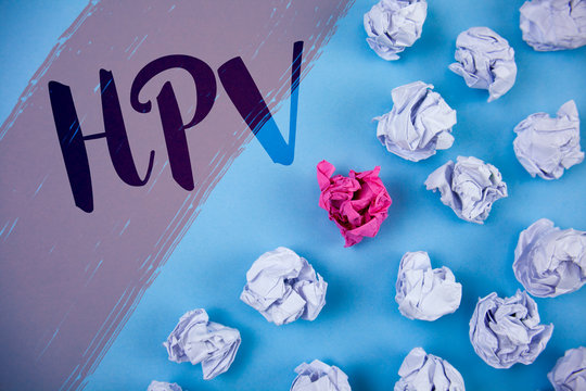 Writing note showing Hpv. Business photo showcasing Human Papillomavirus Infection Sexually Transmitted Disease Illness written Painted background Crumpled Paper Balls next to it.