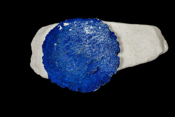 Macro mineral stone Azurite in siltstone against black background