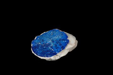 Macro mineral stone Azurite in siltstone against black background