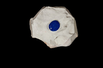 Macro mineral stone Azurite in siltstone against black background