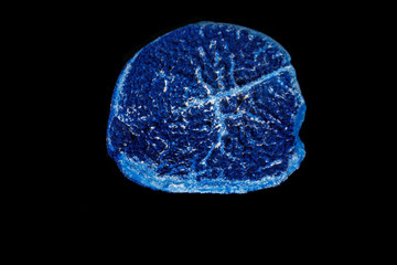 Macro mineral stone Azurite in siltstone against black background