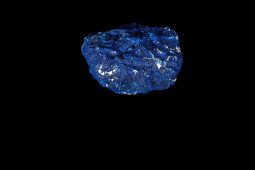 Macro mineral stone Azurite in siltstone against black background