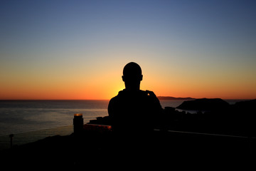 silhouette of man at sunset