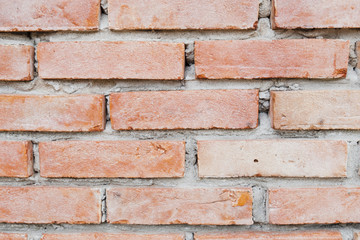 Obraz premium Close up photo of a red brick wall background