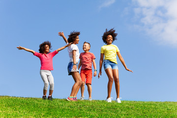 Group of happy dancing and jumping children