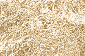 Gold wrinkled paper texture abstract background