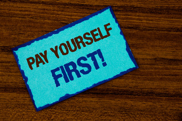 Text sign showing Pay Yourself First Motivational Call. Conceptual photo Personal Finance Save money for future written Sticky note paper the Wooden background.