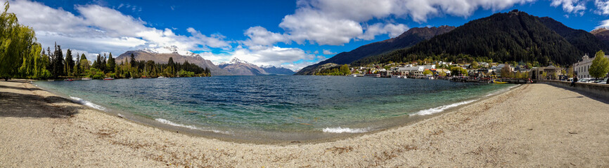 A panorama of Queenstown and Lake Wakatipu taken from the edge of the lake