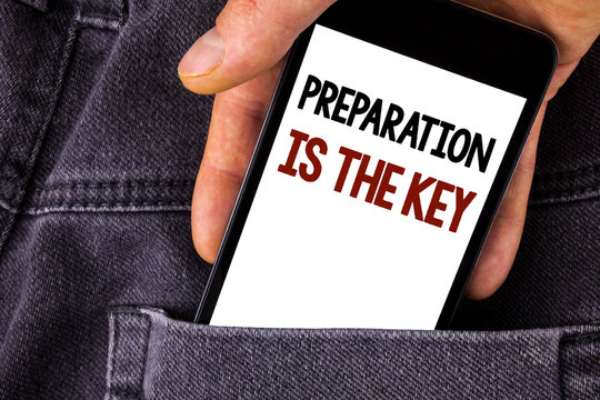 Conceptual hand writing showing Preparation Is The Key. Business photo text Learn Study Prepare yourself for achieving success written Mobile Phone holding by man the Jeans background.