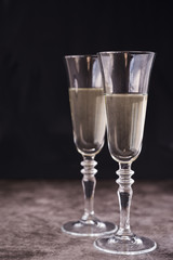 Close-up of champagne glass on concrete background