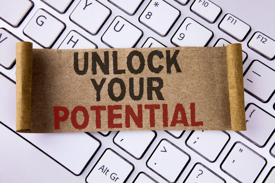 Conceptual hand writing showing Unlock Your Potential. Business photo showcasing Reveal talent Develop abilities Show personal skills written Folded Cardboard Paper Piece placed Keyboard.