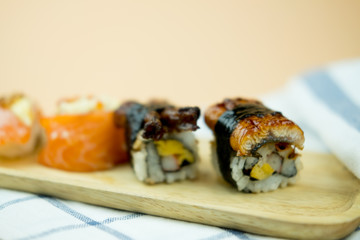Unagi eel sushi on wood tray
